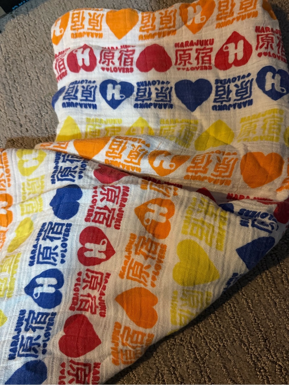 aden + anais White Cotton baby blanket with Harajuku lovers print